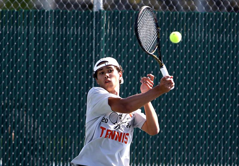 St. Charles East’s Tiernan Price returns the ball as he competes in the Class 2A Boys State Tennis Tournament on Thursday, May 23, 2024, at Hersey High School in Arlington Heights.