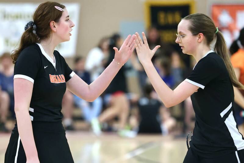 DeKalb’s Kaitlyn Davis (left) and her partner Lea Guelde celebrate a point Friday, May 12, 2023, during their doubles match against Joliet Central at the IHSA State Badminton Finals at DeKalb High School.