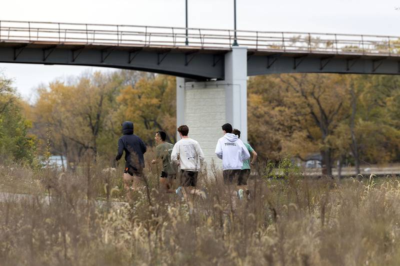 The Dixon boys cross country runs through their drills Thursday, Nov. 6, 2025. The team is gearing up for this weekend’s state tournament.