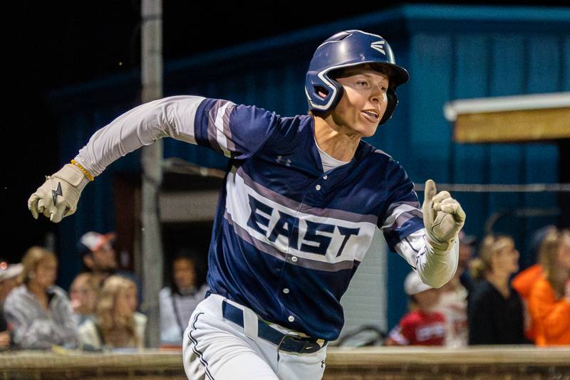 Oswego East's Michael Polubinski (1) doubles driving in a run during Oswego a baseball game at Oswego High School on Tuesday, May 9, 2023.