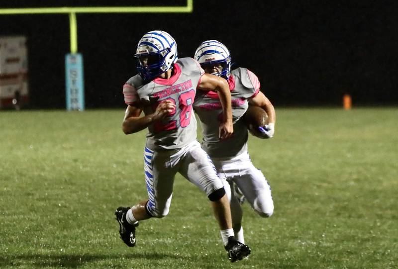 Princeton's Preston Arkels throws a lead block for Casey Etheridge Friday night at Bureau Valley.