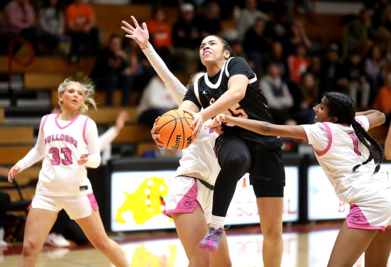 St. Charles East's Corinne Reed goes up for a shot during a game against Batavia on Thursday, Feb. 6, 2025 in Batavia.