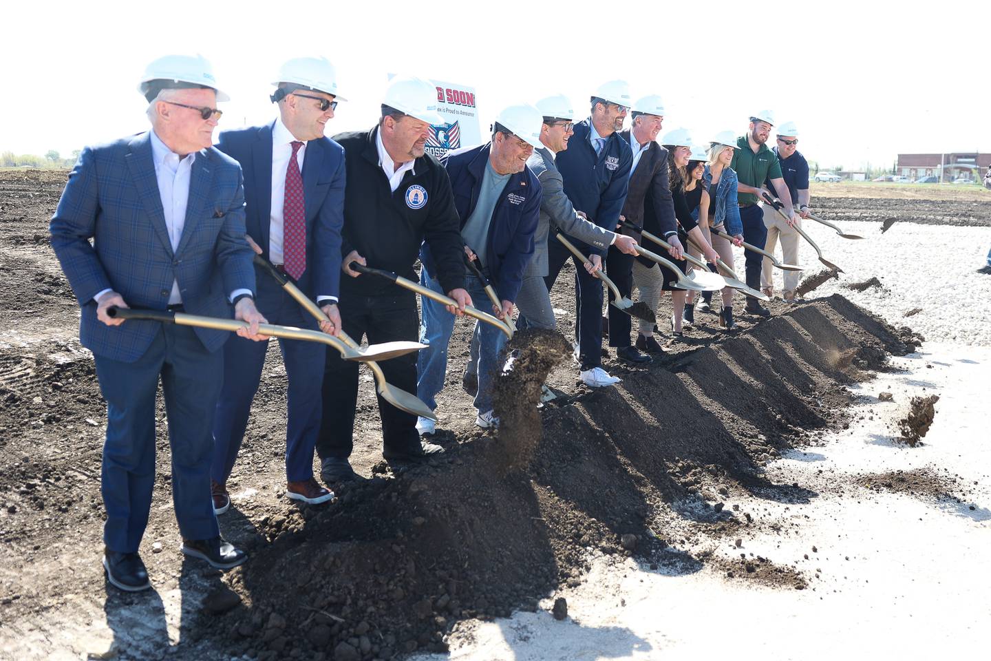 New Lenox officials along members involved with the New Lenox Crossroads Sports Complex development do a photo op at the ground breaking ceremony of the 100 acre sports complex on Monday, April 22, 2024 in New Lenox.