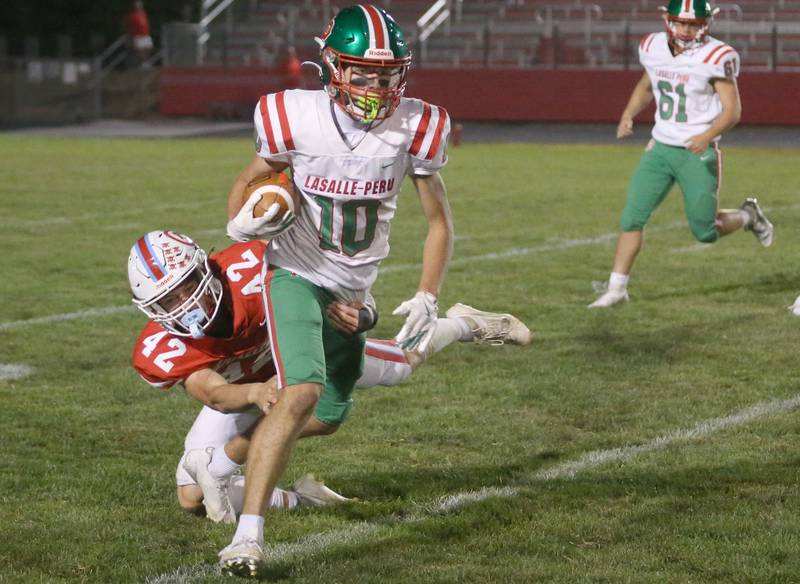 L-P's Greyson Ernat gets out of a tackle by Ottawa's Joey Liebhart on Friday, Sept. 12, 2025 at King Field.