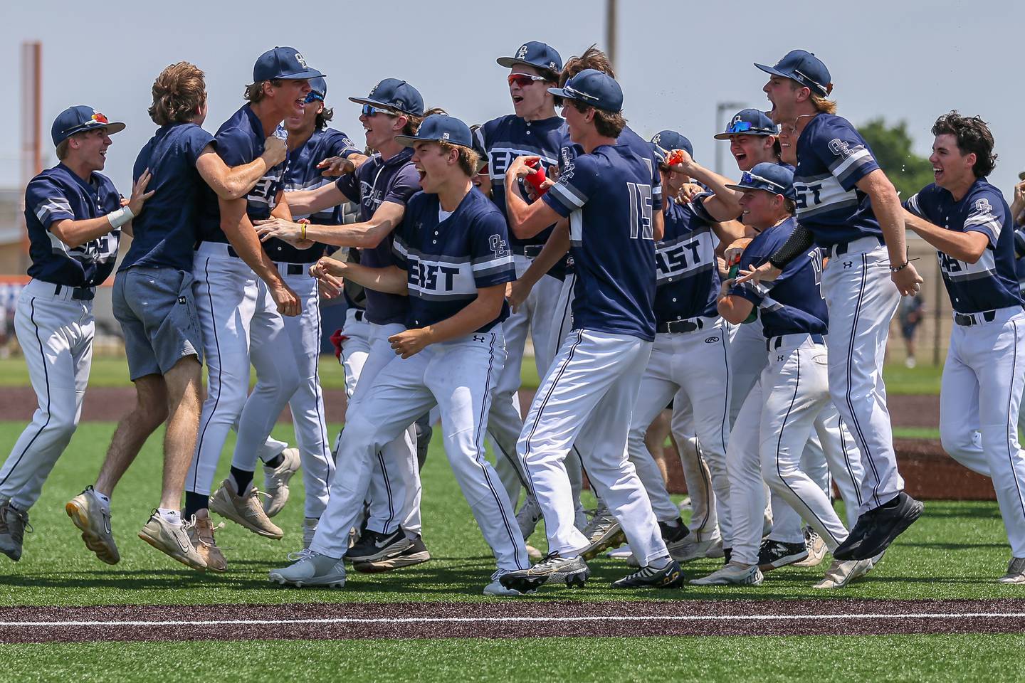 Oswego East celebrates the victory over Oswego in their Class 4A Romeoville Sectional final game.  June 3, 2023.