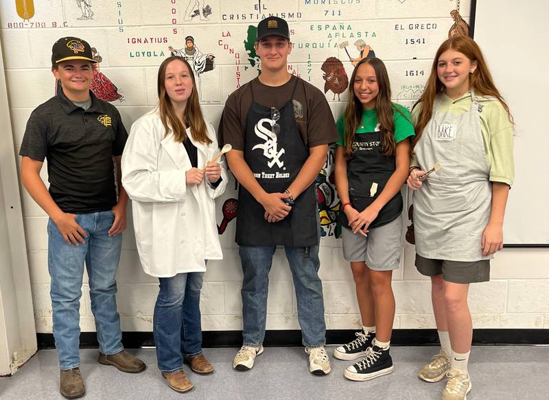 Pictured are the Officer Team of the PCHS Interact Club dressed in their Halloween grilling costumes:Co-Secretary-Jacob Edens; Mikenna Boyd Treasurer; Nicholas Currie, President; Azael Vargas, Vice President; Co-Secretary Eme Bouxsein and Maggie Spratt Social and Print Media Manager.
