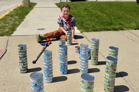 Marseilles boy again collecting tuna for the Marseilles Food Pantry