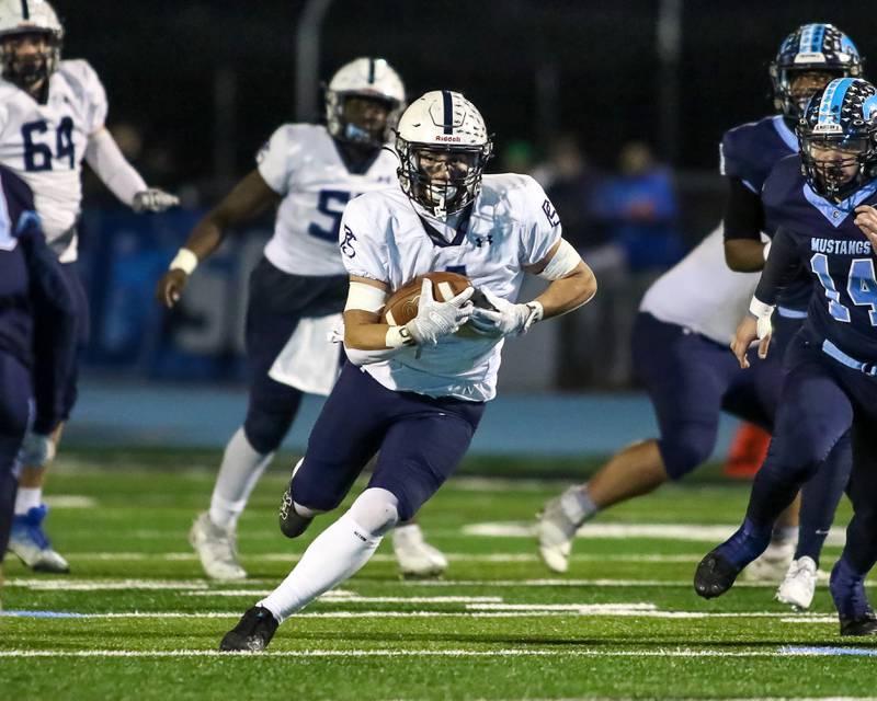 Plainfield South's Chase Pierceall (4) runs up the middle during Class 8A Playoff football game between Plainfield South at Downers Grove South on Friday, Nov 1, 2024  in Downers Grove.