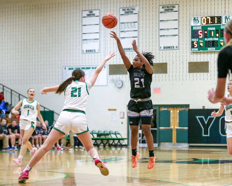 Oswego East's Desiree Merritt (21) shoots a jump shot in their York Thanksgiving Tournament game between Oswego East at York on Monday, Nov 18, 2024  in Elmurst.
