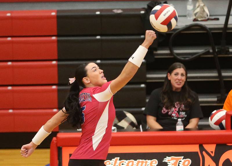 Princeton's Keely Lawson punches the ball over the net to Hall on Thursday, Oct. 9, 2025 at Hall High School.