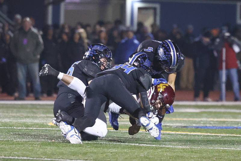 Loyola’s Joyce Owen is brought down by a host of Lincoln-Way East defenders in the Class 8A semifinal on Saturday, Nov. 23, 2024 in Frankfort.