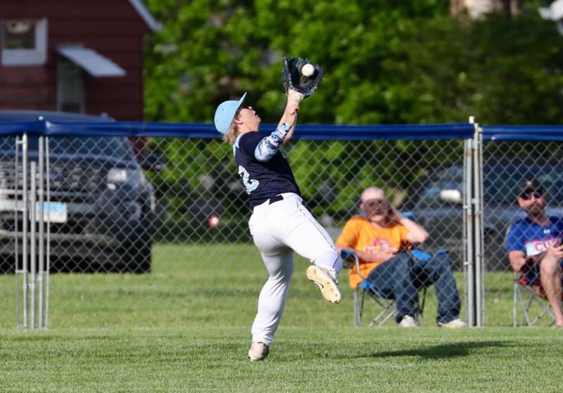 Bureau Valley left fielder Justin Kopp tracks down a fly in Thursday's 5-4 regional semifinal win over Riverdale Thursday.