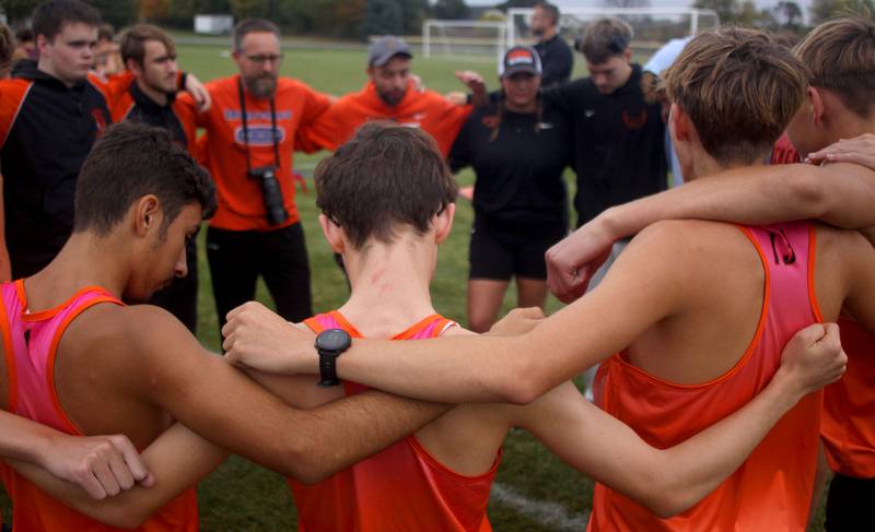 McHenry’s Warriors gather before the boys race as part of the Fox Valley Conference Cross Country Meet at McHenry County College in Crystal Lake on Saturday, October. 18, 2025.