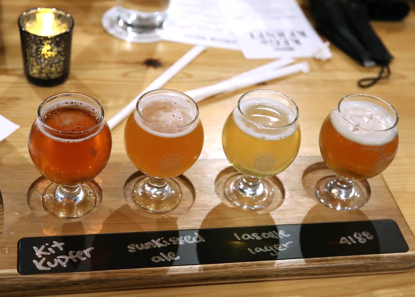 A flight of beer is served at Keg & Kernel by Tangled Roots Brewing Company Wednesday, Dec. 8, 2021, after the ribbon cutting ceremony at the restaurant at 106 East Lincoln Highway in DeKalb.