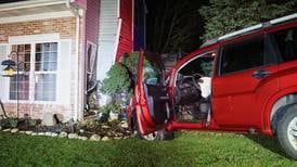 Car crashes into Woodstock home, lands inches from where resident sat
