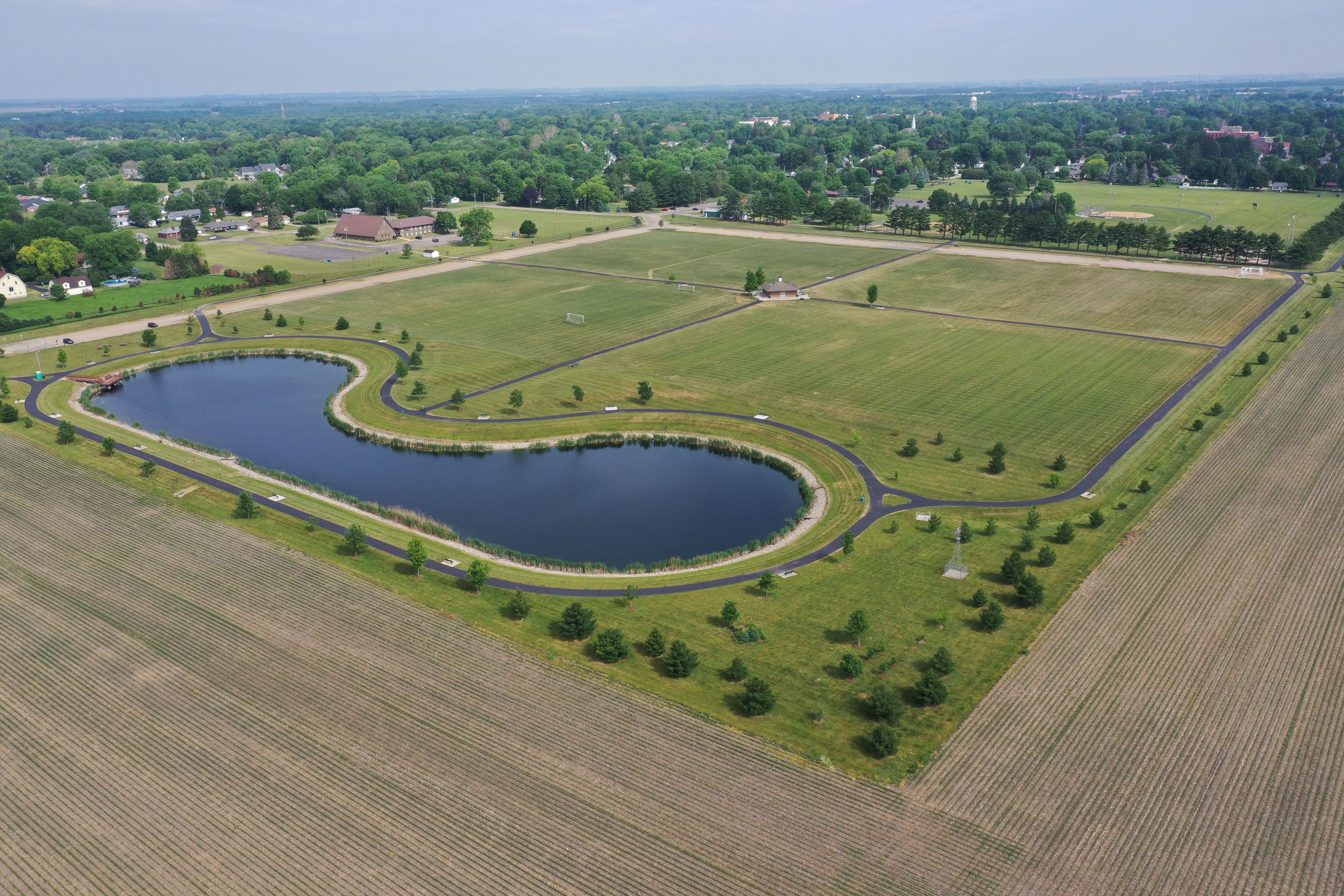 An aerial view of the lake at Zearing Park shows a field of corn looking brown on Wednesday, June 7, 2023, in Princeton. 