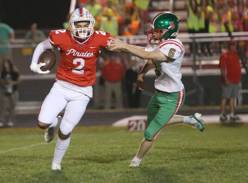 Ottawa's Andrew Vercolio tries to break free of L-P's Joel Lightle on a run on Friday, Sept. 12, 2025 at King Field.