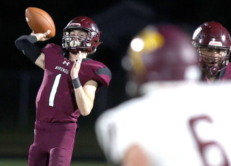 Marengo’s David Lopez passes against Richmond-Burton in varsity football at Rod Poppe Field in Marengo Thursday night.