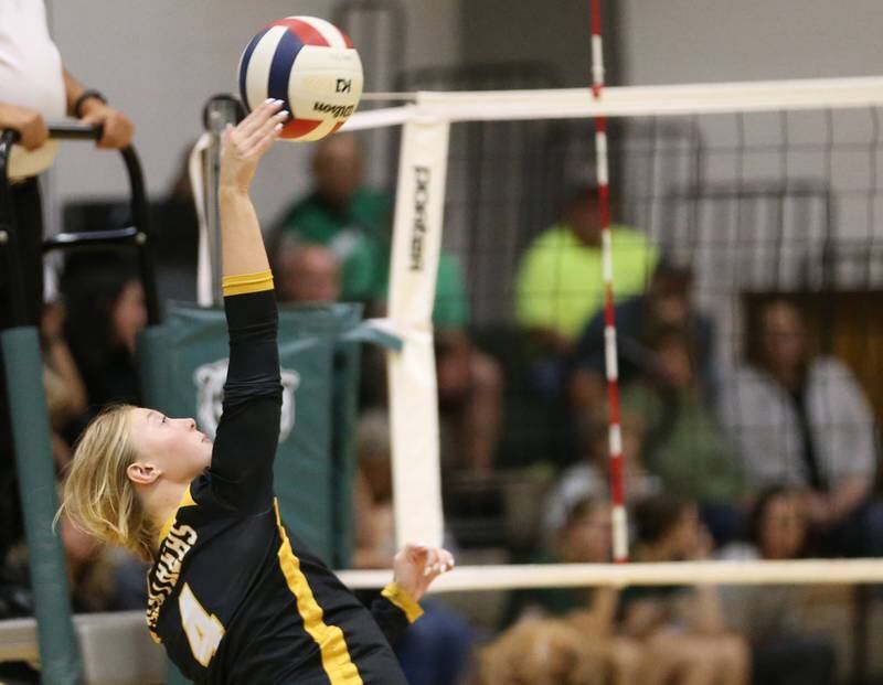 Putnam County's Chloe Andersen spikes the ball to the St. Bede side of the net on Tuesday, Sept. 24, 2024 at St. Bede Academy.