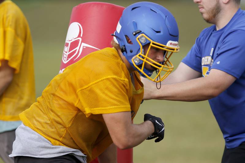 Johnsburg's Forest Hull works on defensive drills during football practice at Johnsburg High School on Tuesday, Aug. 10, 2021 in Johnsburg.