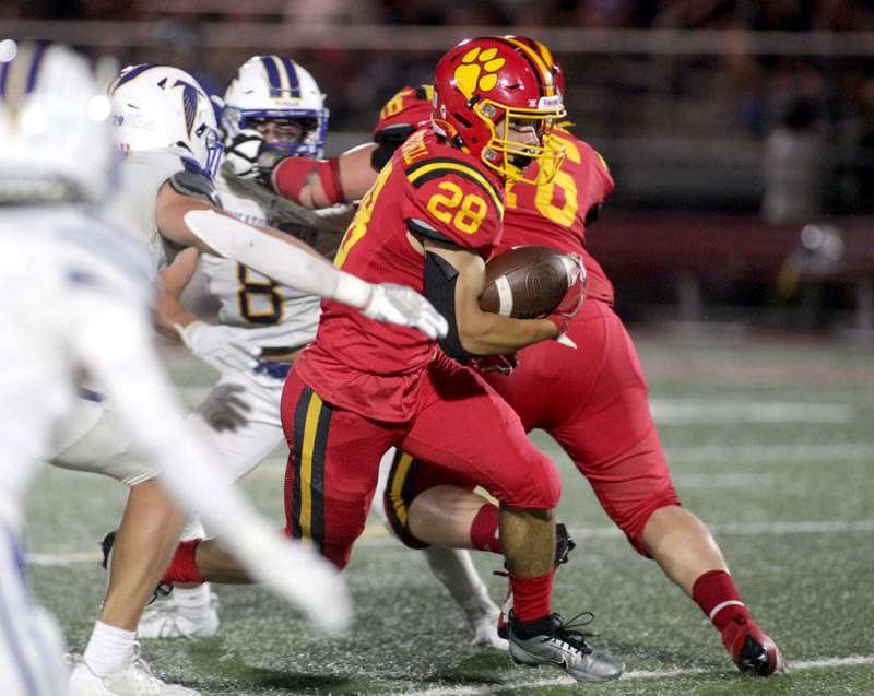Batavia’s Nathan Whitwell runs the ball during a home game against Wheaton North on Friday, Sept. 22, 2023.