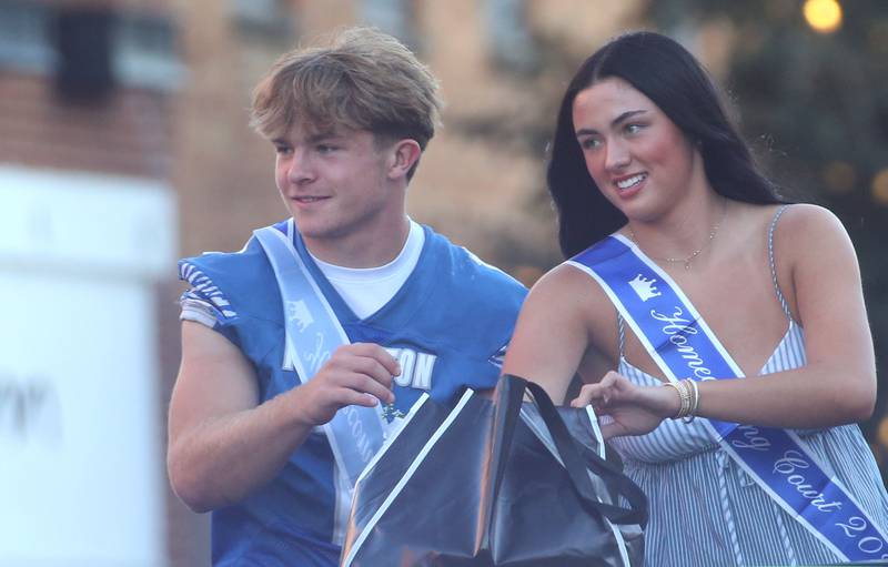 Senior court attendants Casey Ethridge and Keely Lawson ride during the Princeton High School homecoming parade on Thursday, Sept. 25, 2025 along South Main Street in Princeton .