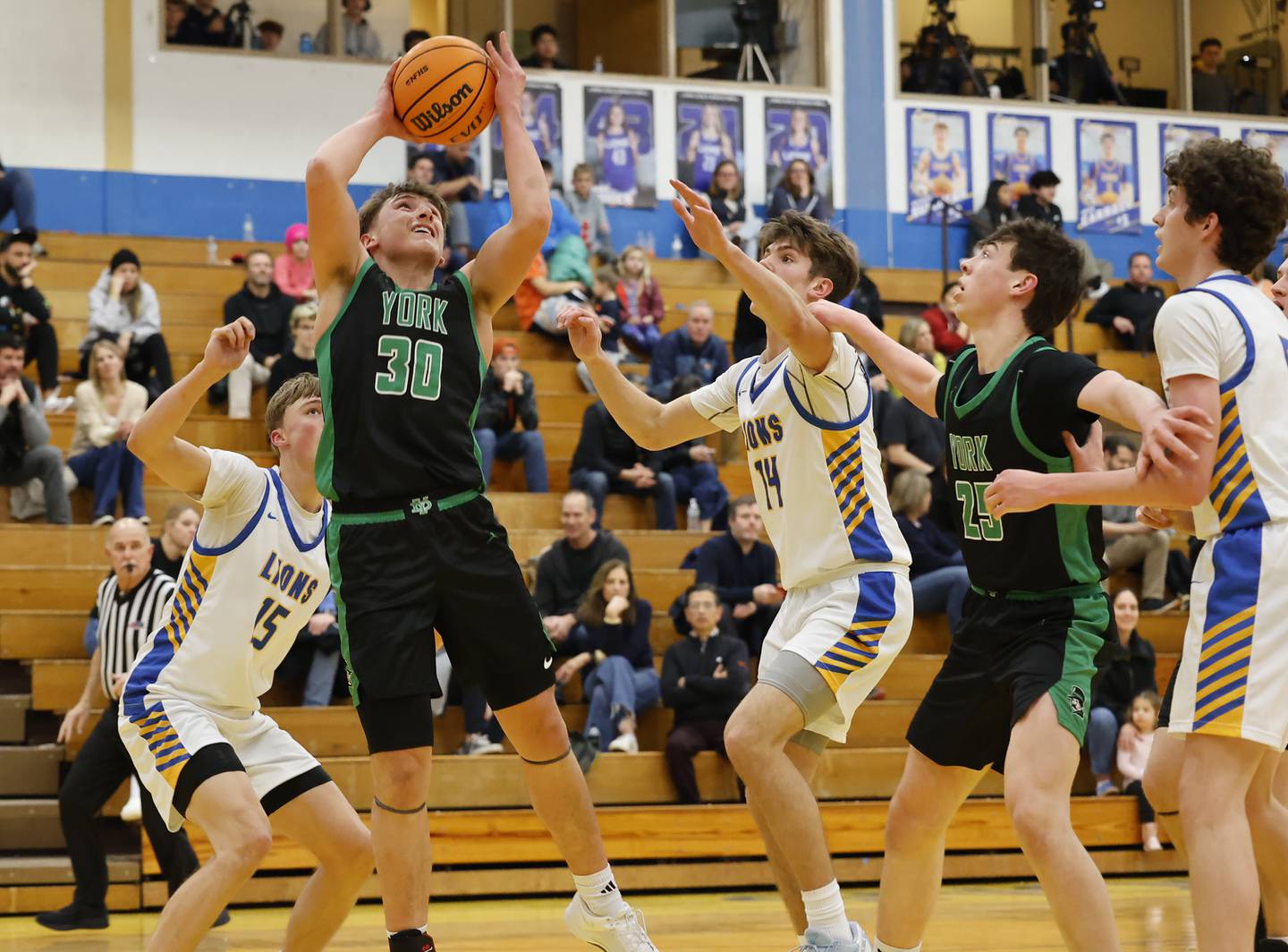 York's Will O'Leary (30) grabs a rebound during a varsity basketball game between York Community and Lyons Township high schools on Friday, Jan. 9, 2026 in La Grange.