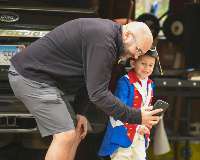 Mclane Meadows, 6, and Dad Luke Meadows FaceTime with friends before heading out to trick or treat for Halloween on Thursday, Oct. 31, 2024, in DeKalb.