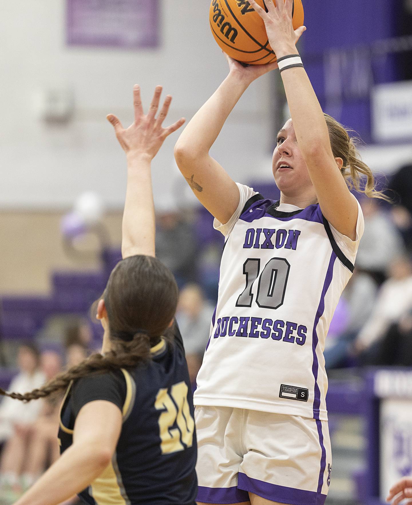 Dixon’s Addy Lohse puts up a shot against Harvest-Westminster’s Paige Nestrick Wednesday, Feb. 11, 2026.