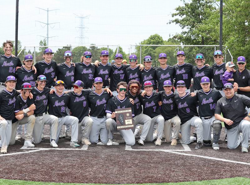 Downers Grove North pose with the championship plaque after winning the IHSA Class 4A baseball regional final between Downers Grove North and Hinsdale Central at Bolingbrook High School on Saturday, May 27, 2023.