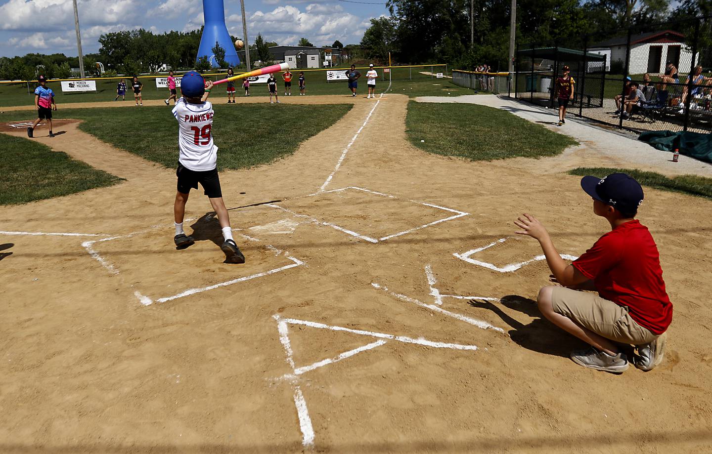 Casen Pankiewicz hits the ball during a celebration of life Wiffle ball game in memory of Alan Kroll on Monday, June 30, 2025, at the McHenry VFW. Kroll, 11, was killed in a June 23 crash near Marengo. Over 50, kids of all ages to part in the game to have fun in Alan's memory. His initials and number are on the diamond.