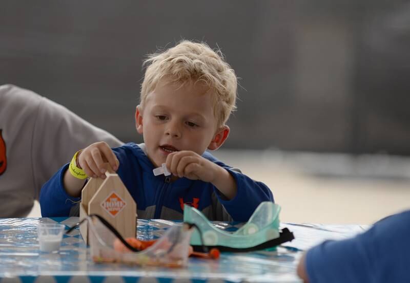 Children including Darragh Paul of Downers Grove decorate their took boxes while attending the Downers Grove Octoberfest Saturday, Sept. 16, 2023.
