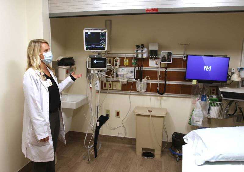 Kristen Tindall, emergency department manager at Northwestern Medicine Kishwaukee Hospital, talks Wednesday, Oct. 20, 2021, about some of the safety features in the behavioral health suite, including an overhead door that can be lowered to ensure the patient is not able to access any equipment that could be used to cause self-harm, during a tour of the recently opened phase 1 at the facility. The full $12 million renovation of the emergency department is expected to be completed in Sept. 2022.