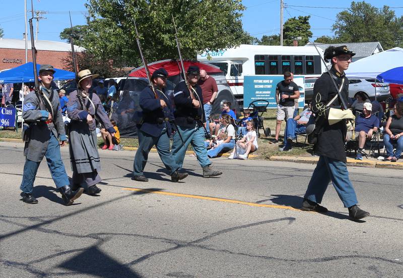 Bureau County Historical Society volunteers walk during the 52nd annual Homestead Festival parade on Saturday, Sept. 9, 2023 in Princeton.
