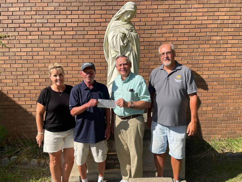 (Left to right) Dolly Telford, board member of St. Vincent de Paul; Joe Barichello, Knights of Columbus golf league president; Bob Gubbels, president of St. Vincent de Paul and Kevin Kusnerick, grand knight of Knights of Columbus, pose for a photo after the golf outing raised money for St. Vincent de Paul.