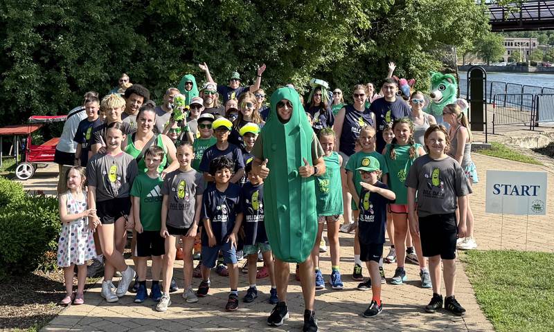 Runners pose at the starting line before the Dill Dash race began at the second annual Pickle Paradise festival at Pottawatomie Park in St. Charles on June 20, 2025.