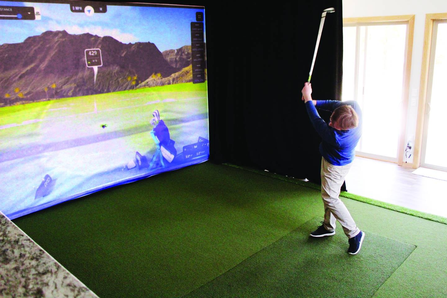 Nathan Studtmann of First Galena Corporation's Golf Performance Studios in Galena designs golf simulation setups that help golfers improve on skill and enjoy a virtual round of golf if they can't get away from home.