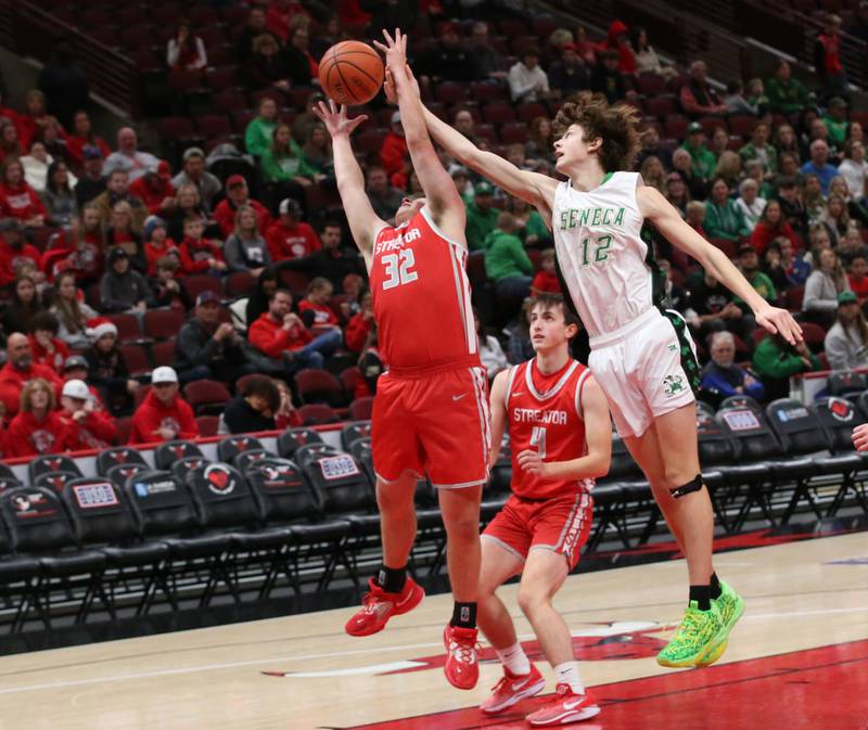 Streator's Andrew Vogel grabs a rebound over Seneca's Sebastian Deering during a game on Tuesday, Dec. 21, 2023 at the United Center in Chicago.