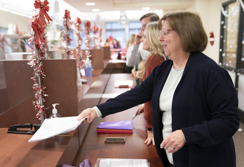 Laurie Parman, of Sleepy Hollow, running for Algonquin-based Community School District 300's school board, delivers her candidate paperwork on Monday, Dec. 12, 2022, the first day area school board candidates could file for the April election, the McHenry County Administration Building in Woodstock.