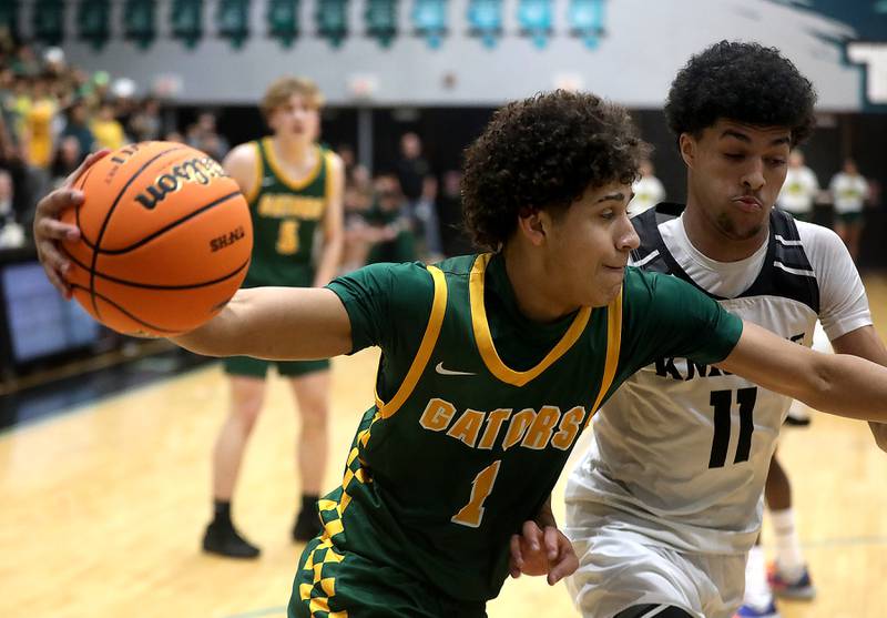 Crystal Lake South's Noah Cook drives the baseline against Kaneland's Evan Frieders during the IHSA Class 3A Woodstock North Sectional final basketball game on Friday, March 6, 2026, at Woodstock North High School.