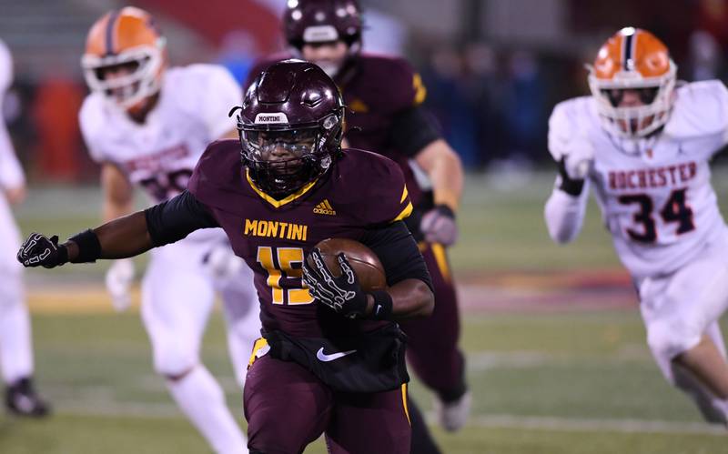 Montini's Charles Flowers carries the ball for a second-quarter touchdown against Rochester during the IHSA Class 4A state championship game on Friday, Nov. 28, 2025 in Normal.