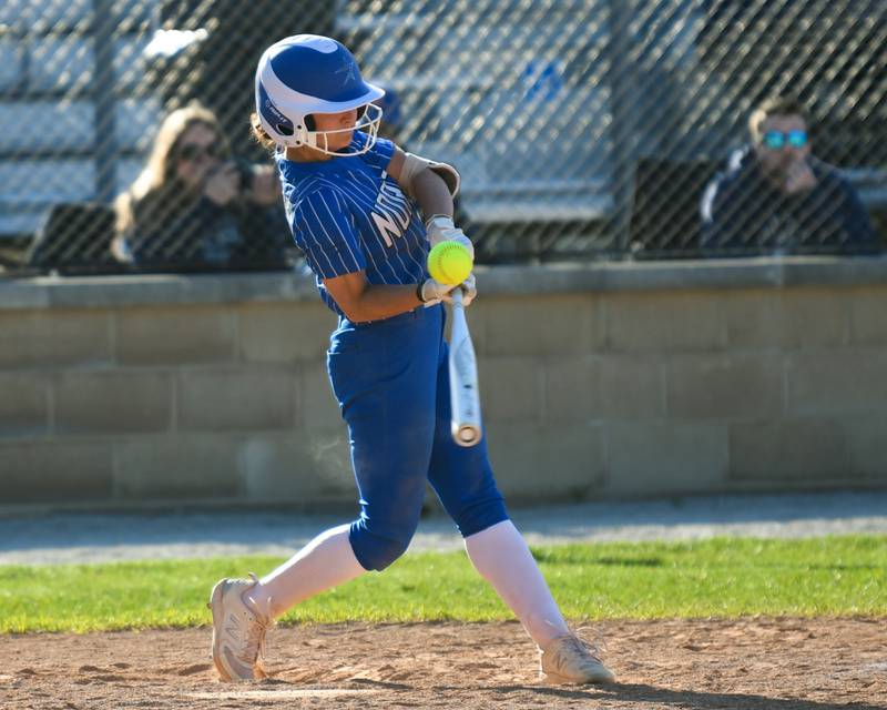 St. Charles North's Ginger Ritter (8) gets a base hit during the game on Wednesday April 24, 2024, while traveling to take on Lake Park High School.