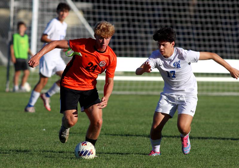 Burlington Central’s Niko Guzman, right, races Crystal Lake Central’s Gavin Kane for the ball in varsity soccer on Thursday Sept. 26, 2024, at Crystal Lake Central High School in Crystal Lake.