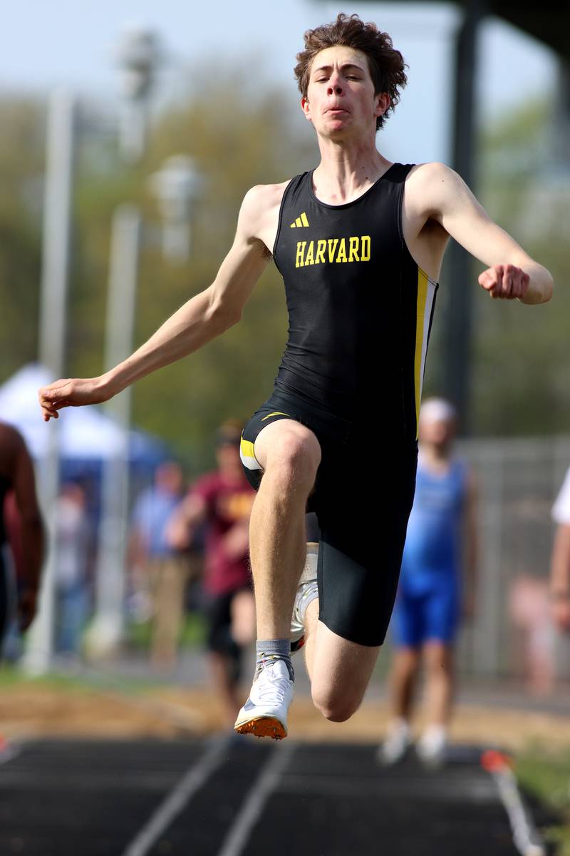 Harvard’s Bernard Bahnsen competes in the triple jump during Kishwaukee River Conference track meet action at Marengo Tuesday night.