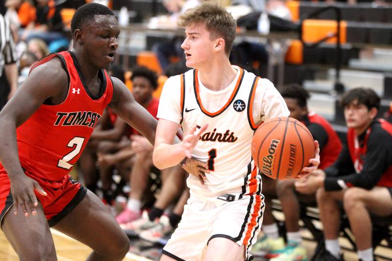 St. Charles East’s Drew Clarke (1) looks to pass the ball away from East Aurora’s Ralph Clark (2) during a game in the 63rd Annual Ron Johnson Thanksgiving Tournament at St. Charles East on Monday, Nov. 21, 2022.