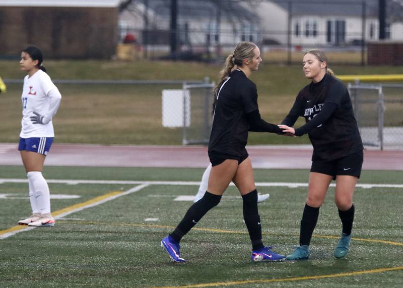 Huntley\s Emma Emricson celebrates he goal with Taylor Klein during a nonconference soccer match against Larkin on Thursday, March 26, 2026, at Huntley High School.