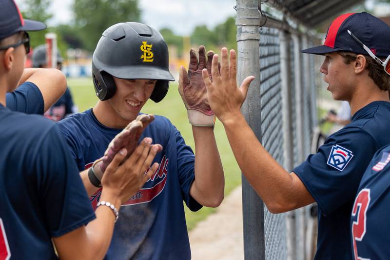 Evan Panther (34) of Illinois celebrates with team after scoring on Thursday, July 17, 2025 at Washington Park in Peru.