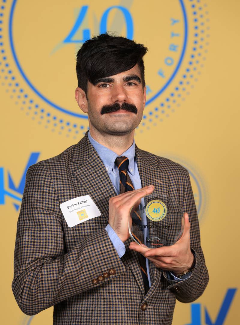 Enrico Eattoni poses with his 40 Under Forty award during the Illinois Valley Chamber of Commerce Champions of Change Awards Night on Thursday, April 10, 2025 at the Westclox Event Center in Peru.