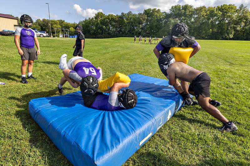 Dixon players run through drills Monday, August 11, 2025, for the first day of football practice.