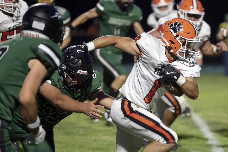 Byron’s Jayce Keesee gets through the Rock Falls defensive line Thursday, August 28, 2025.